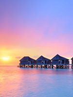 Maldives---Sunset-on-Maldives-island,-water-villas-resort_shutterstock_129221429